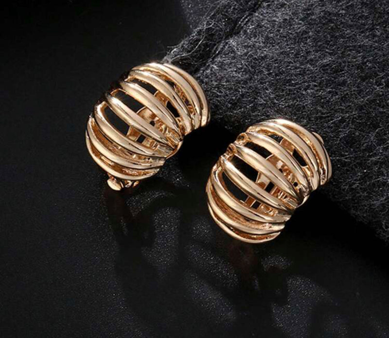 Clip on 1" wide gold cutout bent oval button style earrings