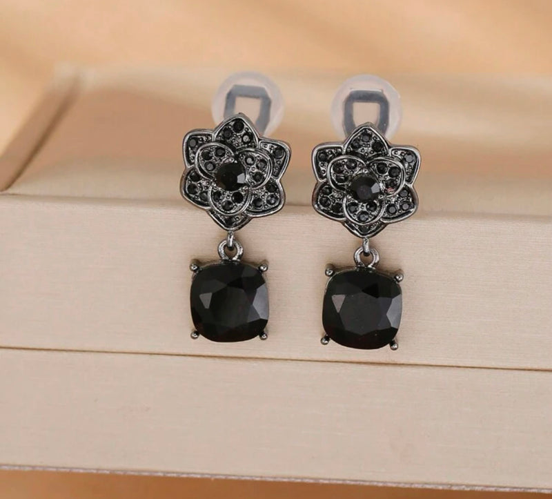 Clip on 1 1/4" gunmetal and black stone flower earrings w/dangle square stone