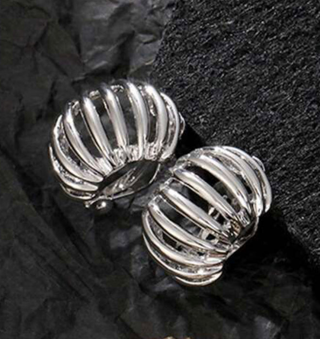 Trendy clip on 1" silver cutout raised earrings