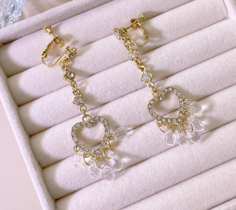 Clip on 2 3/4" gold & clear stone earrings w/dangle heart and clear beads