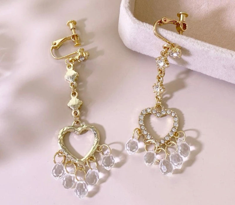 Clip on 2 3/4" gold & clear stone earrings w/dangle heart and clear beads
