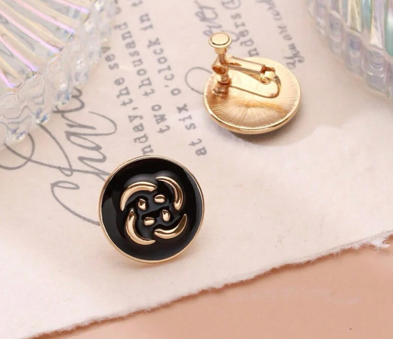 Clip on 1" gold and black flower print button style earrings