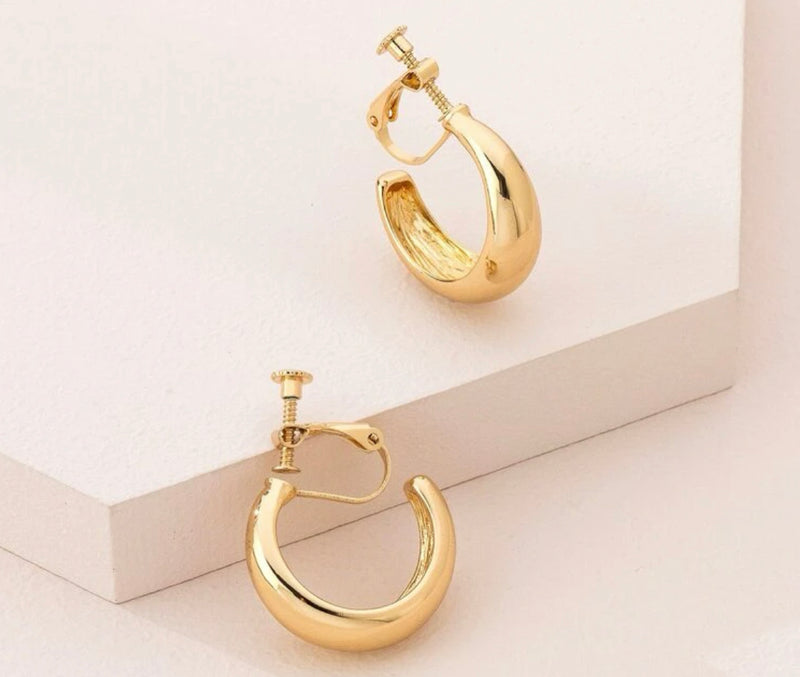 Clip on 1 1/4" shiny gold open back graduated hoop earrings