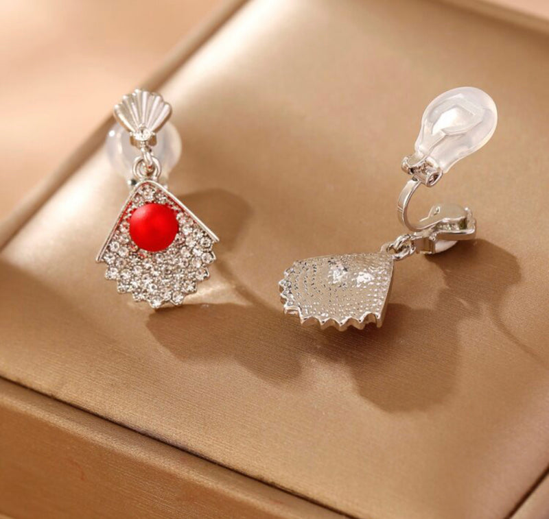 Clip on 1" silver and red bead shell earrings with clear stones