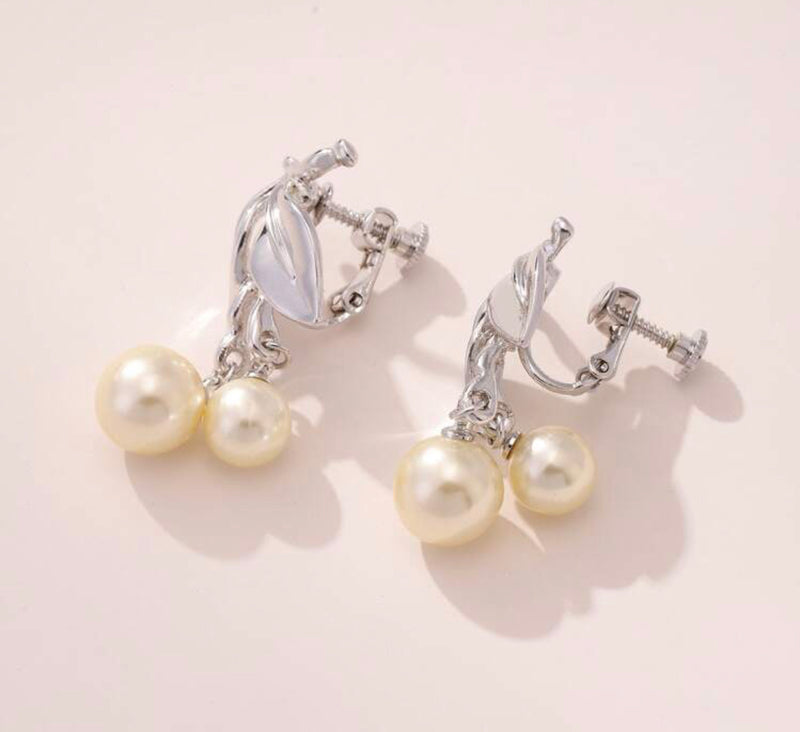 Clip on 1 1/2" silver leaf earrings with dangle cream pearls