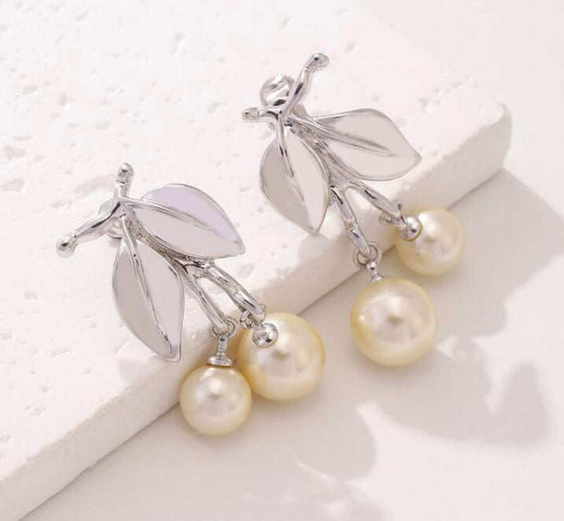 Clip on 1 1/2" silver leaf earrings with dangle cream pearls