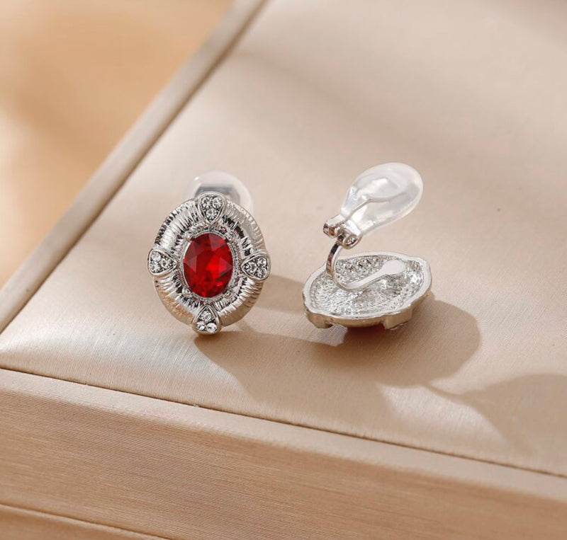 Clip on 3/4" small silver clear and red stone oval earrings