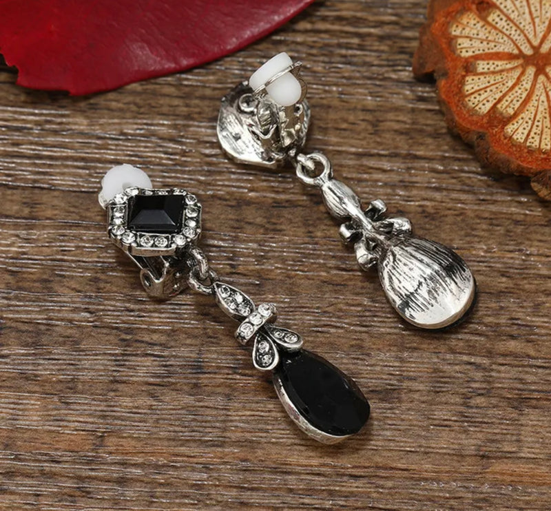 Vintage 1 3/4" clip on silver black and clear stone earrings