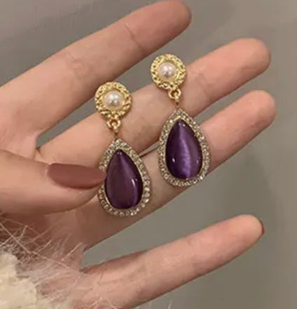 Pierced 1 3/4" gold earrings w/purple, clear teardrop stones & pearl