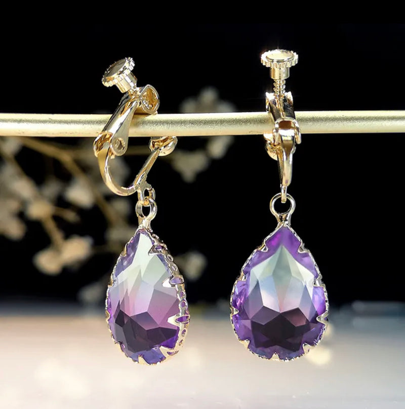 Clip on 1 1/2" gold and purple teardrop stone dangle earrings