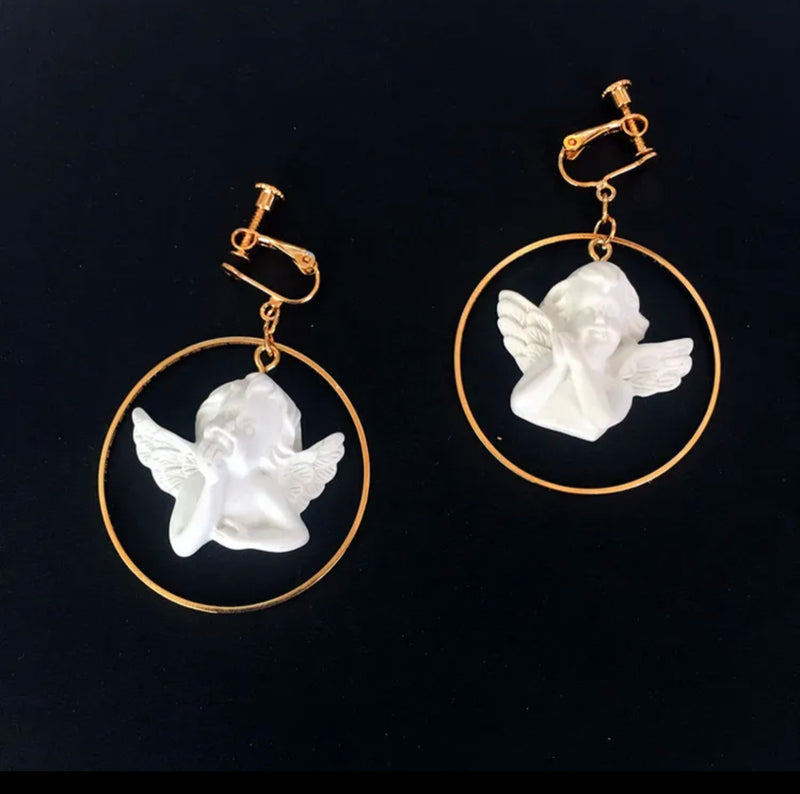 Clip on 2 1/4" gold hoop earrings with white raised angel center