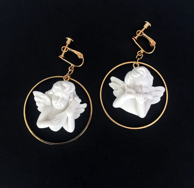 Clip on 2 1/4" gold hoop earrings with white raised angel center