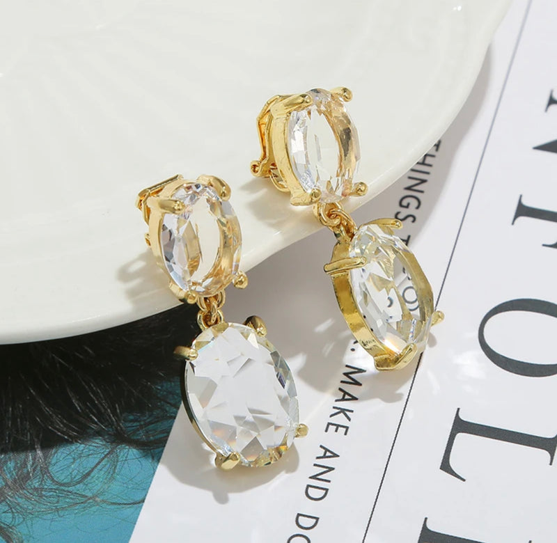 Classy clip on 1 1/2" yellow gold stone dangle oval earrings