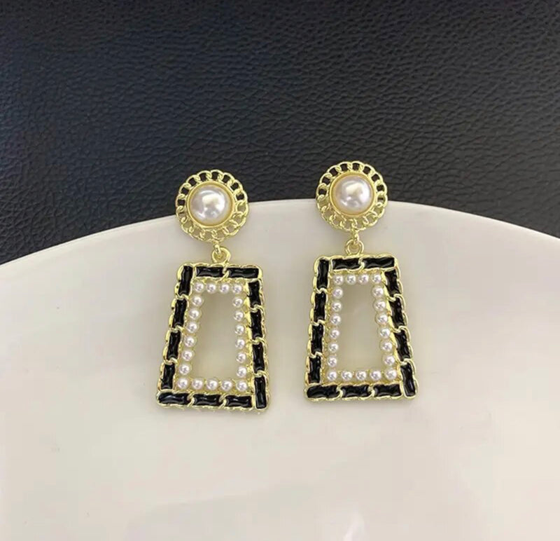 Clip on 1 3/4" gold, pearl earrings w/dangle black ribbon square