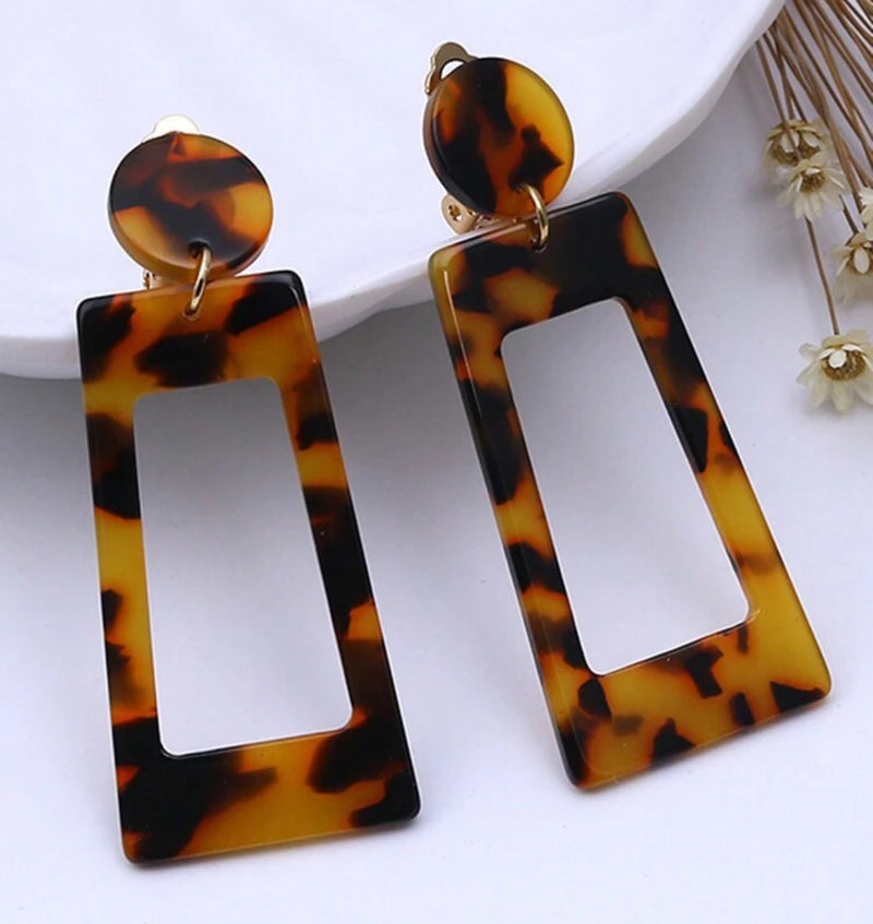 Clip on 2 1/2" gold and plastic brown dangle earrings