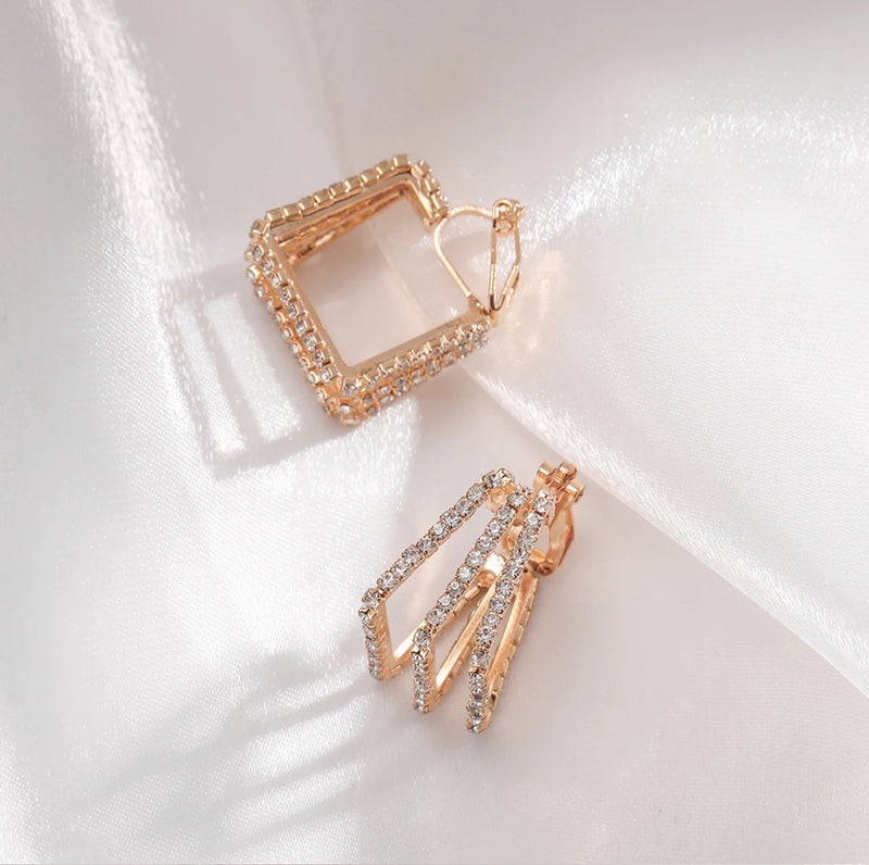 Clip on 3/4" gold and clear stone cutout wide square earrings