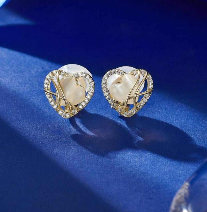 Clip on 1/2" small gold and white stone wire heart earrings with clear stones