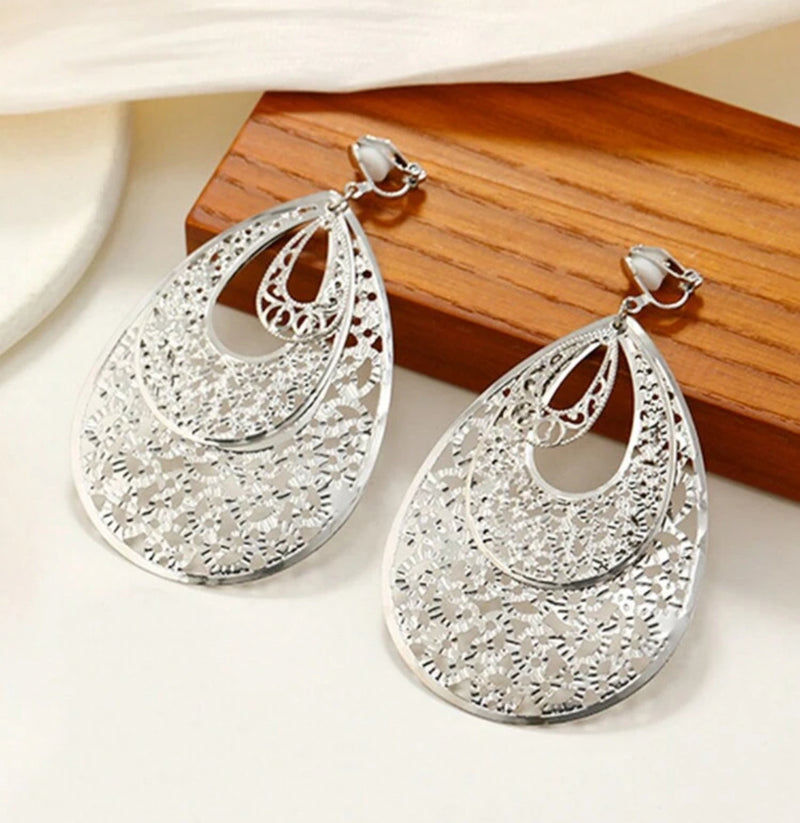 Clip on 3 1/4" silver lightweight layered cutout teardrop dangle earrings