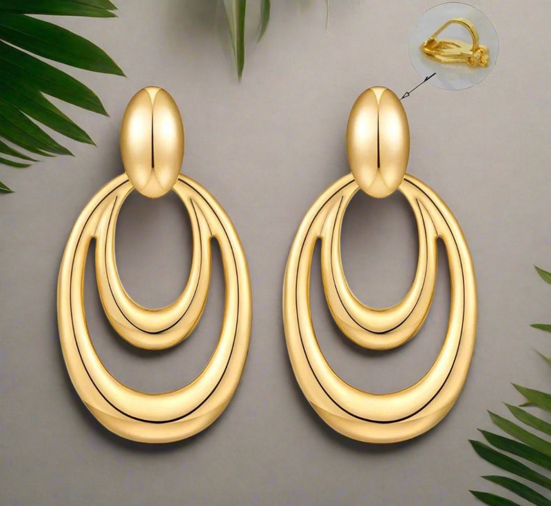 Clip on 2" shiny gold cutout oval dangle earrings