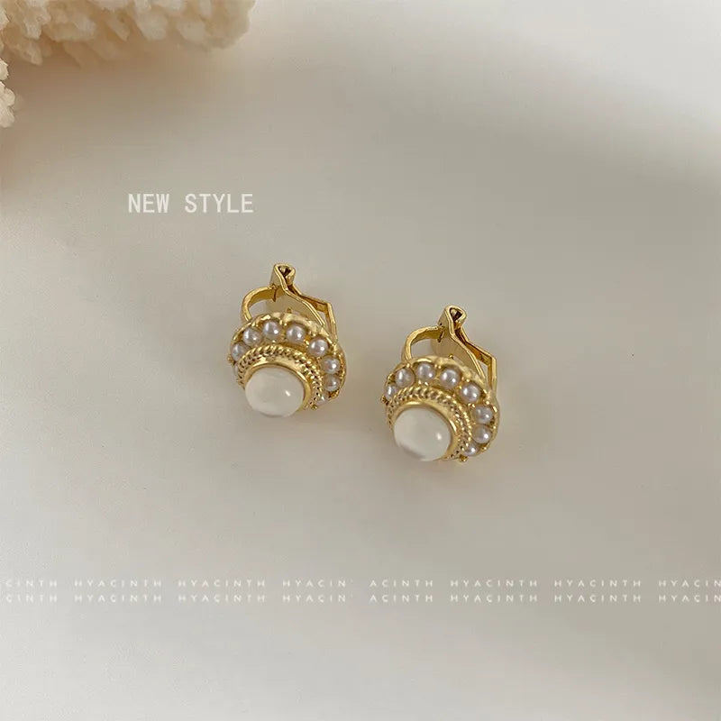 Clip on 1/2" xsmall gold and pearl earrings w/center white bead