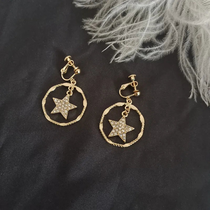 Clip on 1 1/2" gold clear stone star & pinched hoop earrings