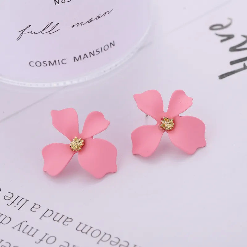 Trendy pierced 1" gold flower earrings in a variety of colors