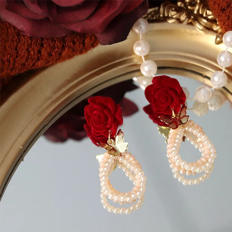 Clip on comfort fit 2 1/4" gold butterfly, red velvet flower earrings w/pearls & beads