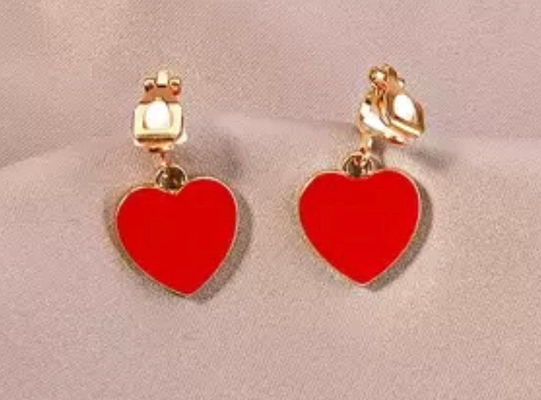 Clip on 1 1/4" gold and red heart dangle earrings
