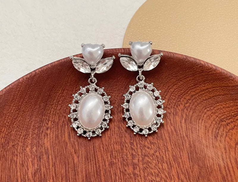 Clip on 1 1/2" silver & white heart pearl earrings w/clear stones