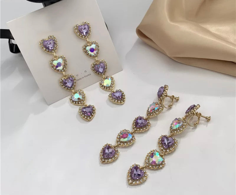 Vintage 3 3/4" clip on purple fluorescent stone dangle heart earrings