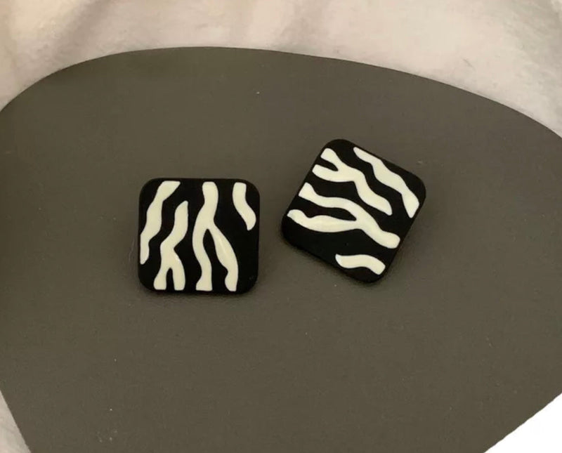 Clip on 1" black and white zebra print button style flat earrings