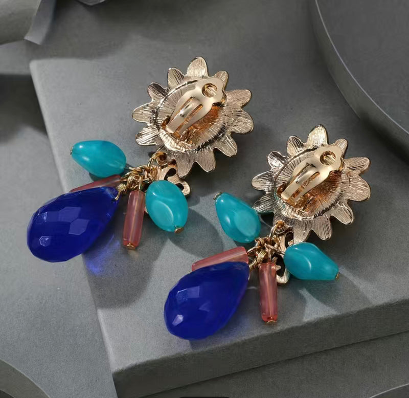 Clip on 2 3/4" gold, orange, multi colored bead earrings with dangle beads