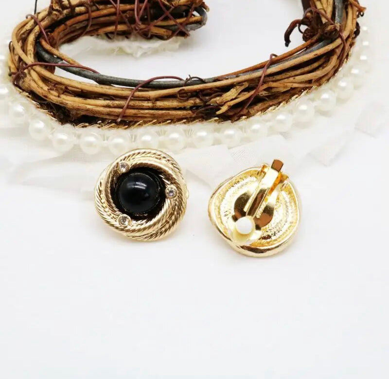 Clip on 1" gold twisted edge black stone button style earrings