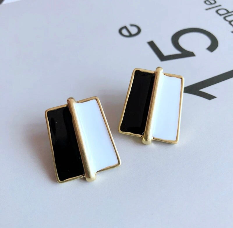 Clip on 1" gold, black and white divided button style earrings