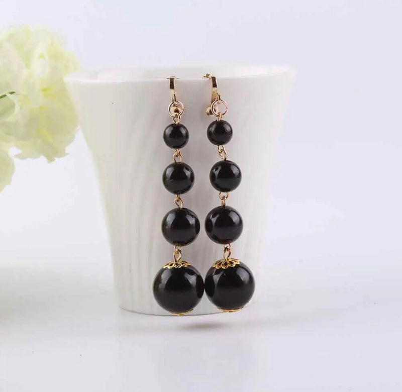Clip on 3" gold and black graduated bead earrings