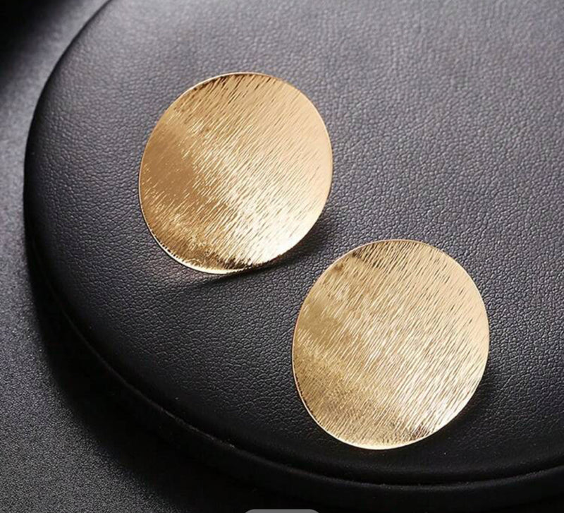 Clip on 1" silver bent textured oval button style earrings