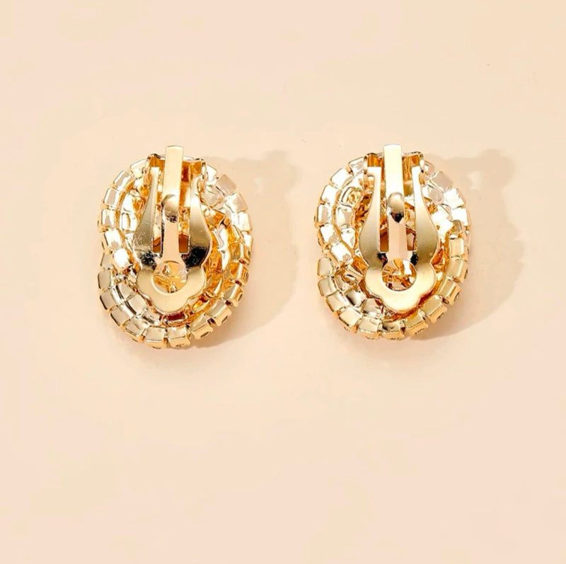 Clip on 1" gold and clear stone loose knot button style earrings
