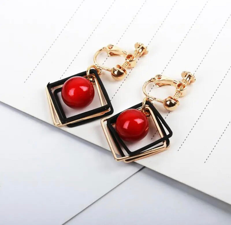 Clip on 1 3/4" gold and black square earrings w/center red bead