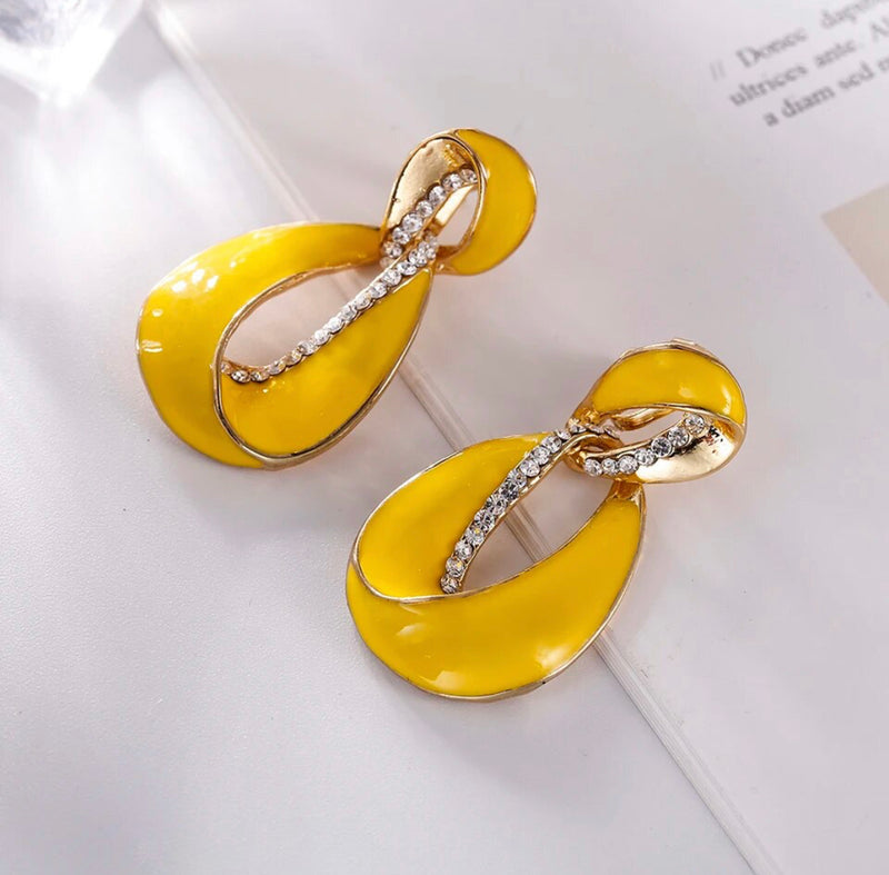 Clip on 1 3/4" gold and yellow earrings with clear stones
