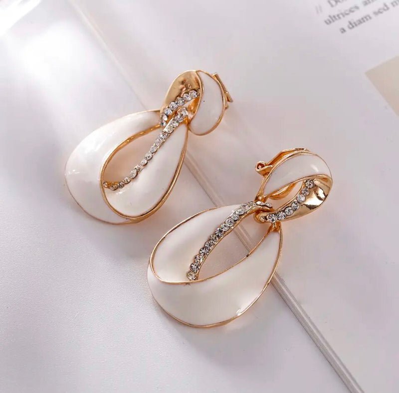 Clip on 1 3/4" gold and white earrings with clear stones