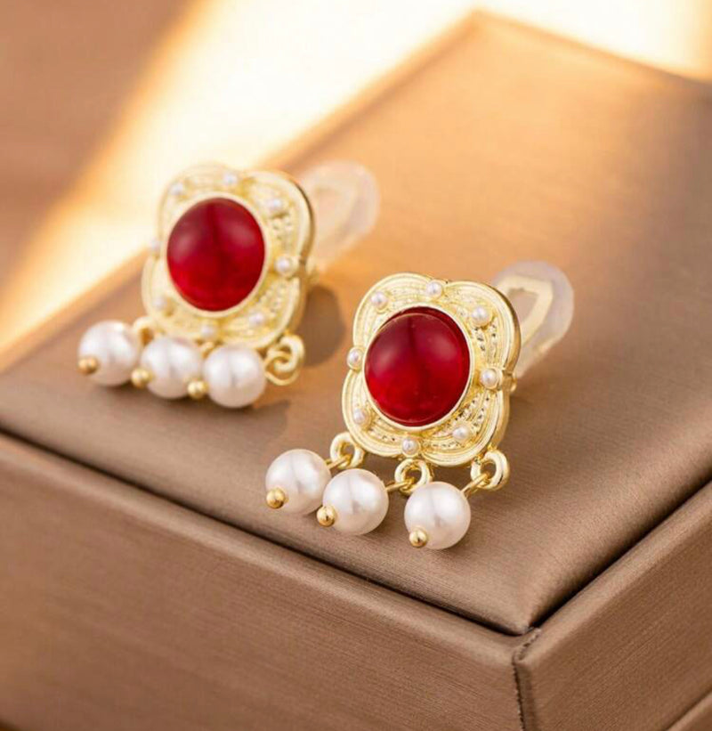 Clip on 1 1/4" gold earrings with red stone and dangle white pearls