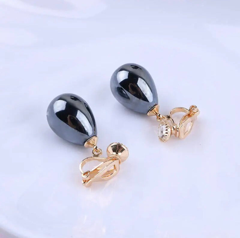Clip on 1 1/4" gold and shiny gray dangle teardrop bead earrings