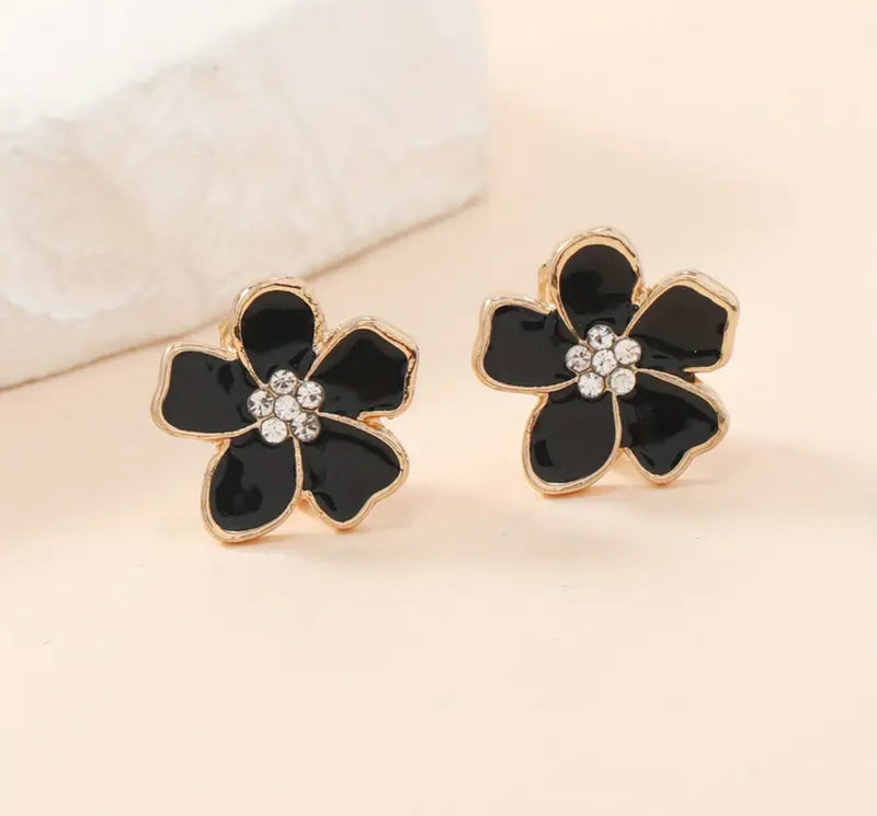 Clip on 1/2" small gold and black flower earrings with center clear stones