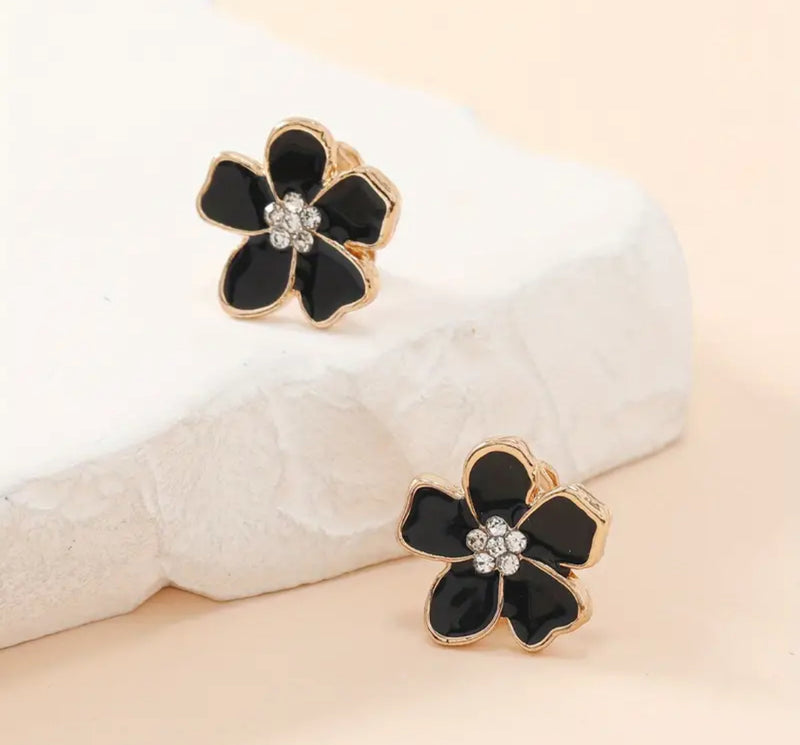 Clip on 1/2" small gold and black flower earrings with center clear stones