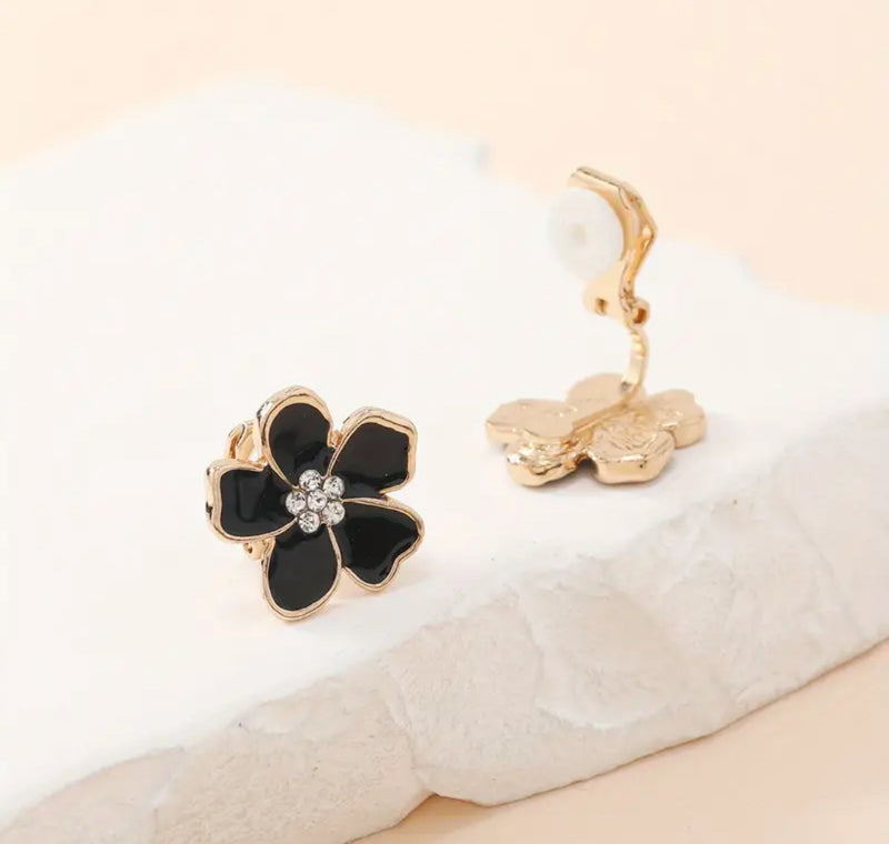 Clip on 1/2" small gold and black flower earrings with center clear stones