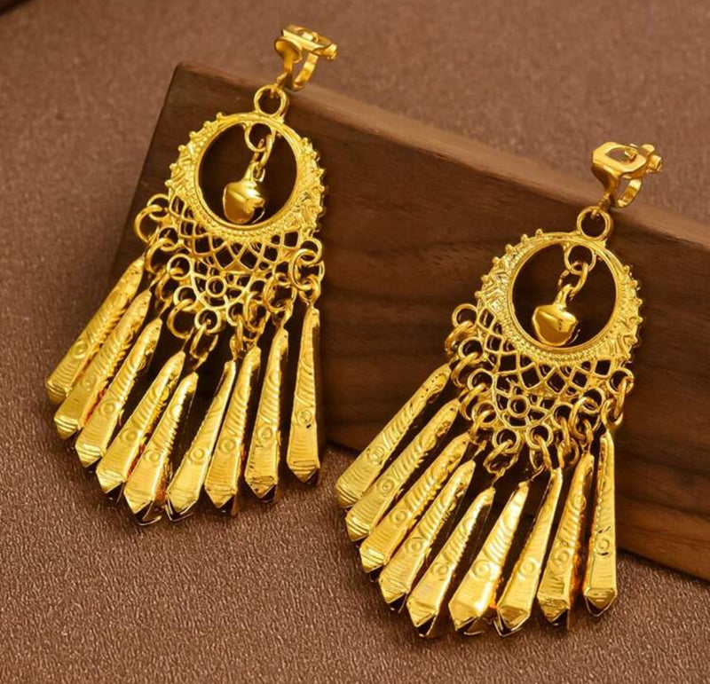 Clip on 2 3/4" golden cutout raised dangle tassel earrings