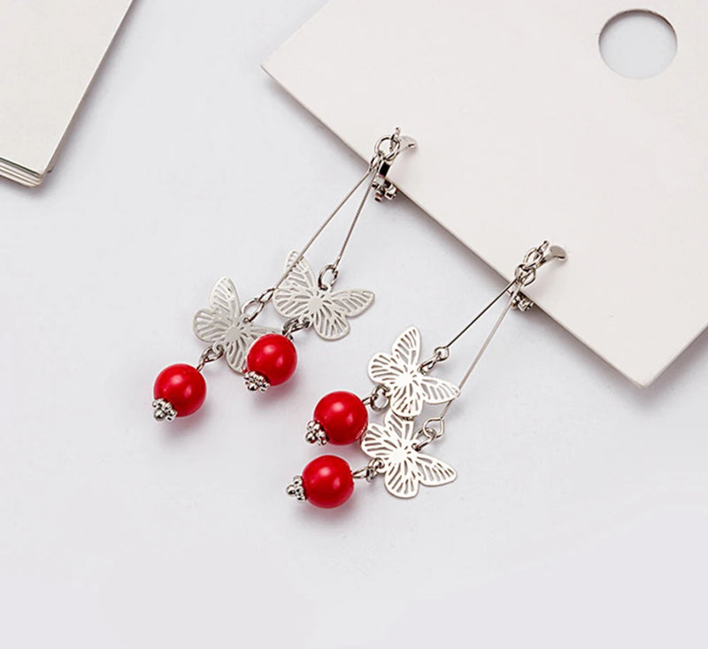 Clip on 2 3/4" silver and red bead dangle butterfly earrings