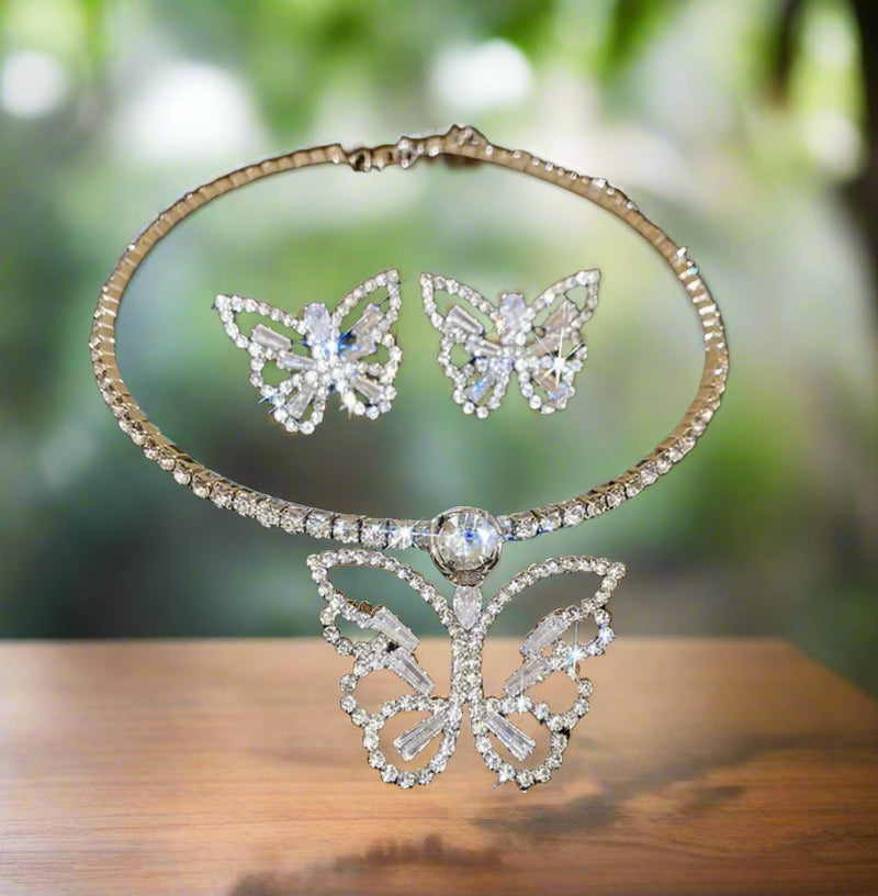 Pierced silver and clear stone wire cutout butterfly necklace and earring set
