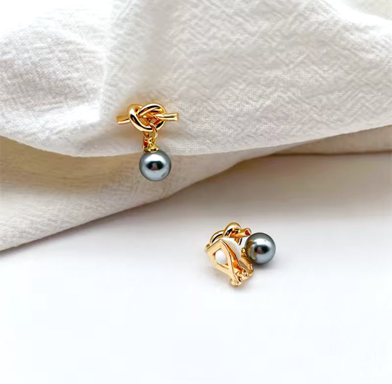 Clip on 1" gold knot earrings with dangle gray pearl