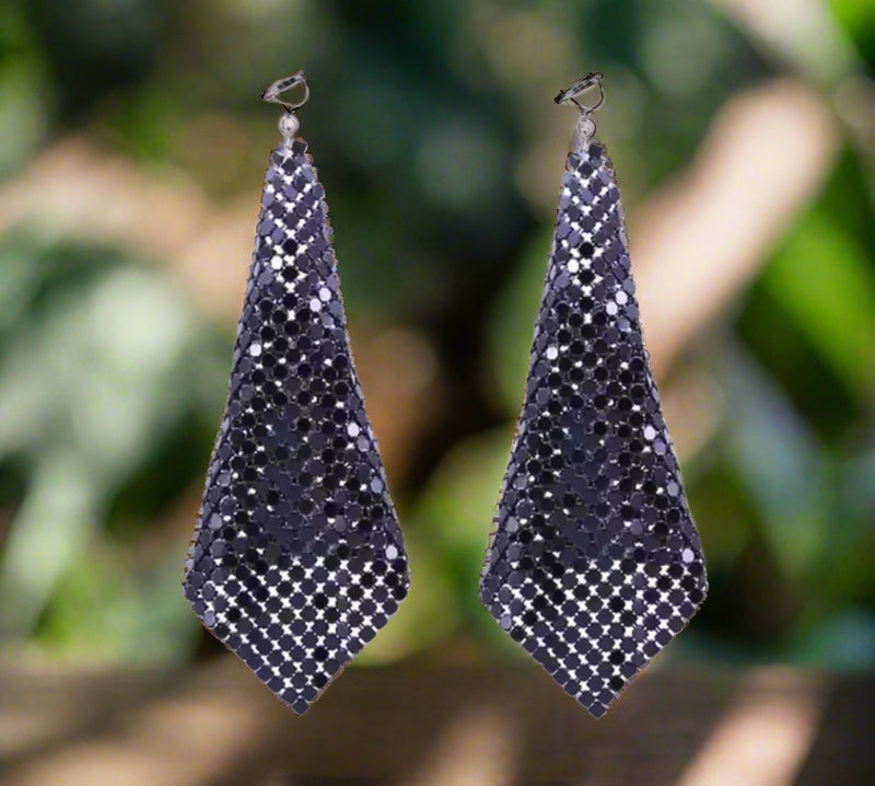 Clip on 2 1/2" matte silver cutout wavy dangle pointed earrings